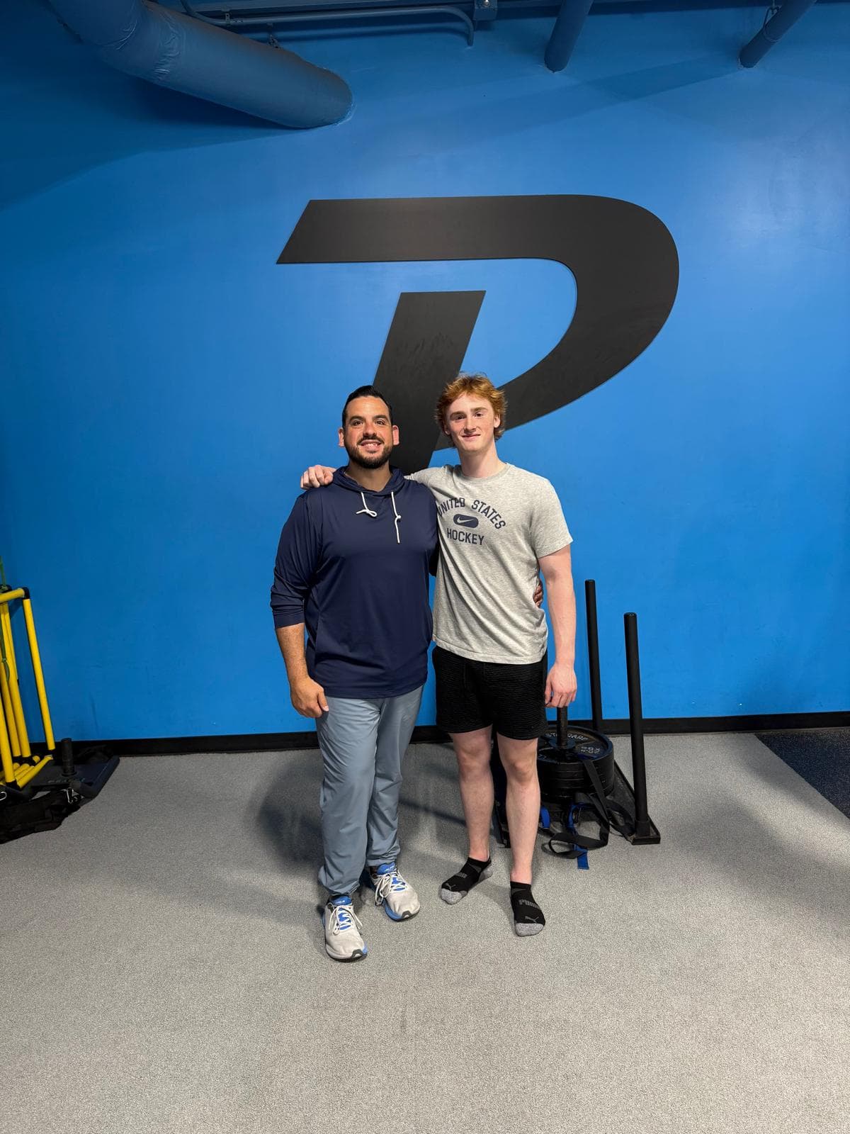 Jonathan Reyes with an athlete at Phyx Performance